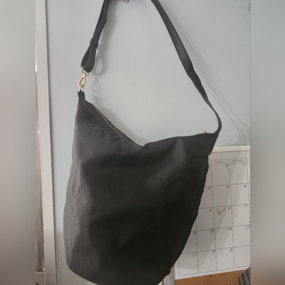 A new day convertible sling backpack